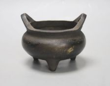 A Chinese bronze tripod censer, Xuande four character mark height 10cm