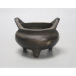 A Chinese bronze tripod censer, Xuande four character mark height 10cm