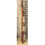 A mahogany curtain pole with rings, length 170cm