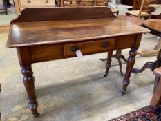 A Victorian mahogany writing tablefitted two small drawers on turned tapered legs, length 106cm,