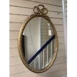 A gilt and composite wall mirror with simulated rope twist frame, width 56cm, height 84cm,