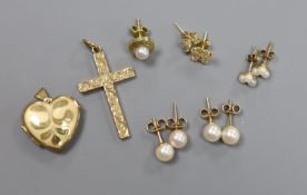 A 9ct gold cross pendant, three pairs of 9ct ear studs, one odd ear stud and a 9ct gold heart