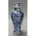 A 19th century Chinese blue and white dragon vase and cover, height 27cm