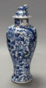 A 19th century Chinese blue and white dragon vase and cover, height 27cm