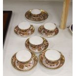 A set of six Spode teacups and saucers and a saucer dish painted with Imari pattern, amrked SPODE
