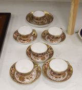 A set of six Spode teacups and saucers and a saucer dish painted with Imari pattern, amrked SPODE