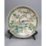 A 19th century Chinese famille verte crackle glaze dish and wood stand, diameter 35cm
