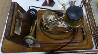 A vintage wood, brass and Bakelite wall-mounted telephone