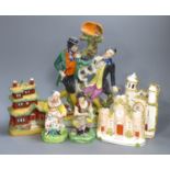 A pair of 19th century Staffordshire figures, 'Jobson' and 'Nellie', two castle flatback groups, a