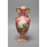 A Coalport pink ground vase and cover, with serpent handle painted with a landscape c.1825, height