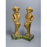 A pair of gilt bronze 'Bacchus' mounts, on Connemara marble bases, height 40cm