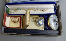 A Halcyon Days Gershwin 'Rhapsody in Blue' music box, no. 339/750, an engine-turned silver compact,