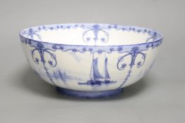 A Royal Crown Derby blue and white bowl painted with sailing scenes, by W.E.J. Dean, diameter 23cm