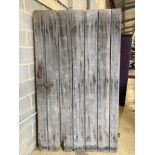 A 19th century oak barn door, width 124cm, height 213cm