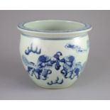 A Chinese blue and white 'lion-dog' flower pot,painted with lion-dogs on white slip, on a pale