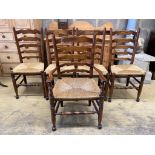 A set of five Lancashire ash and beech rush-seat ladderback chairs (one with arms)