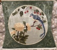 A Chinese washed and embossed panel depicting birds amongst prunus and cherries,unframed, 64 x 62cm