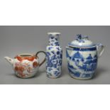 A 19th century Chinese blue and white covered jug, an early 20th century blue and white vase and a