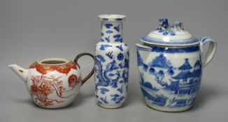 A 19th century Chinese blue and white covered jug, an early 20th century blue and white vase and a