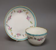 A Chelsea Derby teabowl and saucer painted with flowers, c.1778, blue Crown Derby mark with no