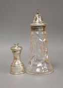 A modern silver pepper mill, Mappin & Web, Sheffield, 1957, 85mm and silver plated mounted glass