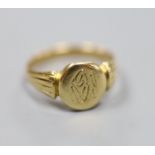 A late Victorian 18ct gold signet ring with engraved crest? (tired), size L/M,4.8 grams.