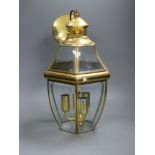 A hexagonal gilt metal and glass hall lantern