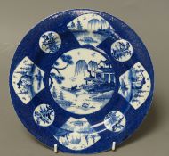 A Bow circular plate painted with landscapes, c.1757, six character mark, 20cm diameter