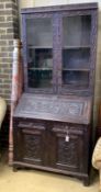 A Victorian carved oak bureau bookcase, width 94cm, depth 54cm, height 203cm