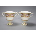 A pair of Derby two handled loving cups, c.1805, painted in arabesque style, pattern no.407, height