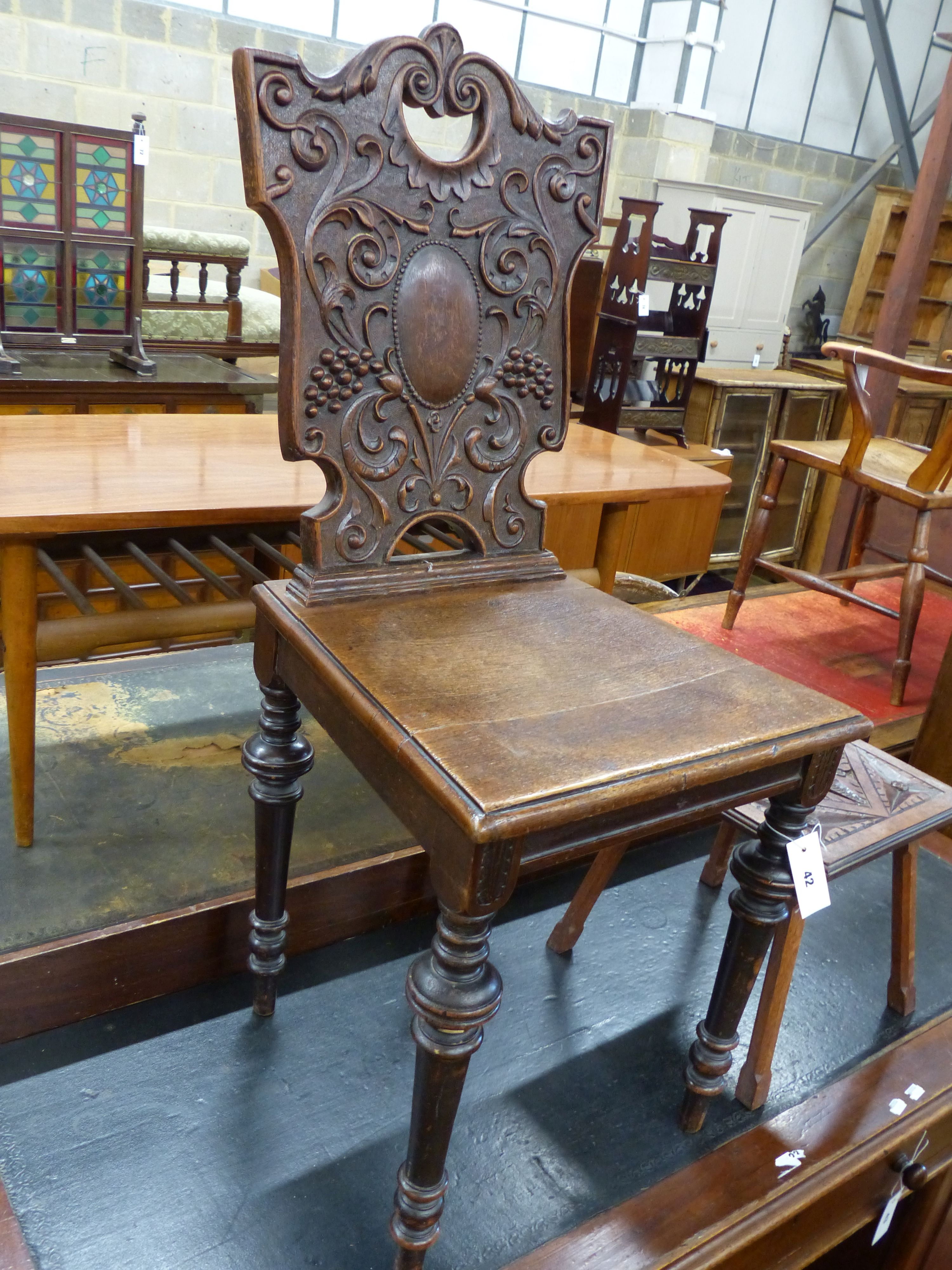 A late Victorian carved oak hall chair and a small occasional table - Image 3 of 3