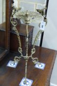 A cast brass jardiniere stand, height 60cm