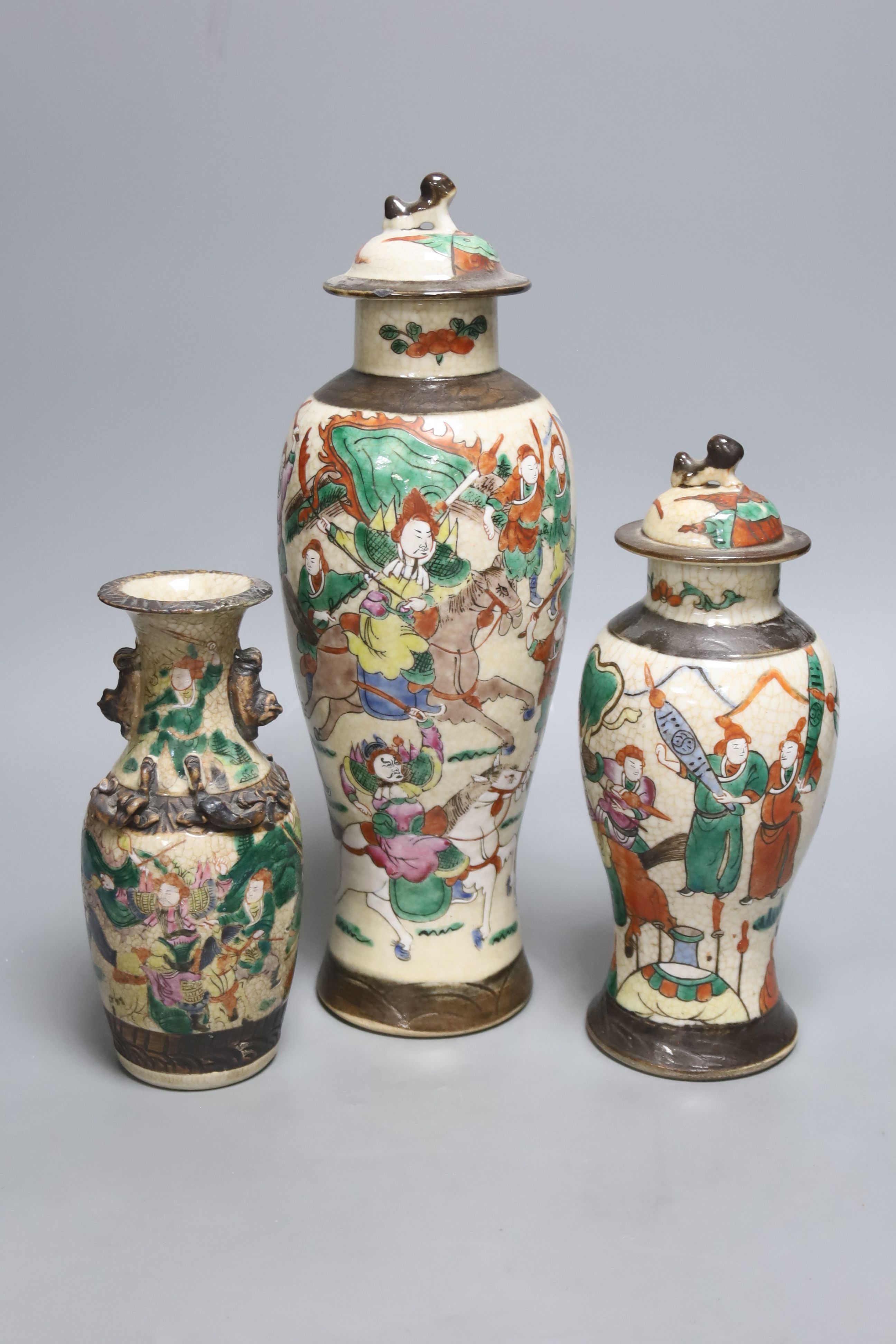 Three early 20th century Chinese crackle glaze vases, two with covers, tallest 33.5cm