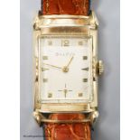 A gentleman's 1930's 10k rolled gold Bulova manual wind rectangular dial wrist watch, with