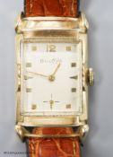 A gentleman's 1930's 10k rolled gold Bulova manual wind rectangular dial wrist watch, with