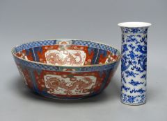 A large Japanese Imari bowl, Meiji period, diameter 31cm, and a Chinese blue and white sleeve vase