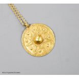 A modern Italian 18ct chain with a circular yellow metal possibly Roman pendant, 30mm, gross weight