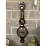 Ciceri and Co., London. A Regency inlaid mahogany wheel barometer and thermometer, length 119cm