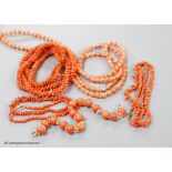 Four assorted coral bead necklaces, largest 148cm and a coral bead bracelet.