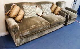 A grey velvet two seat sofa bed, approximately 191 cm wide and a matching armchair, various scatter