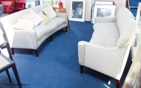 A pair of George III style eau de nil silk damask concave fronted two seat sofas, on square tapered