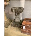 A reconstituted stone pedestal bird bath, height 60cm