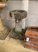 A reconstituted stone pedestal bird bath, height 60cm