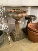 A reconstituted stone pedestal garden urn, height 83cm