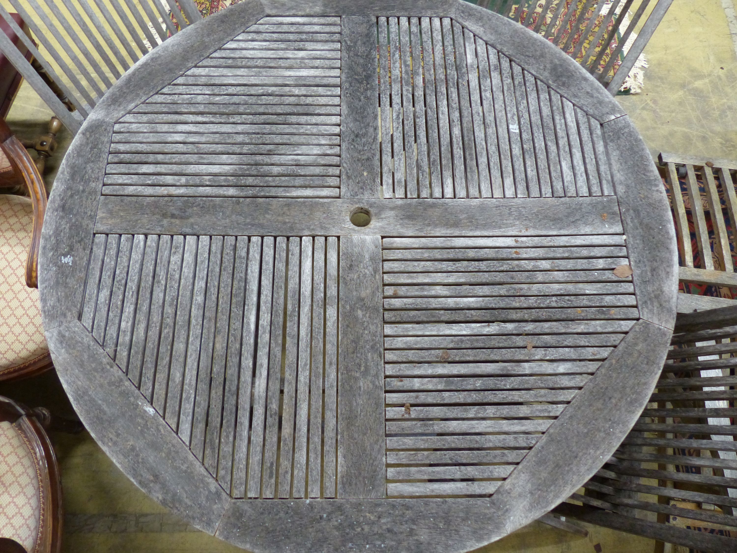 A teak garden table, 125cm diameter and four matching chairs, all folding - Image 3 of 4