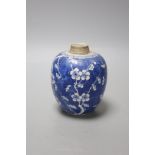 A Chinese Kangxi blue and white prunus jar, lacking cover, height 12cm