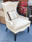 A contemporary upholstered armchairProvenance - a country estate near Rye, Sussex