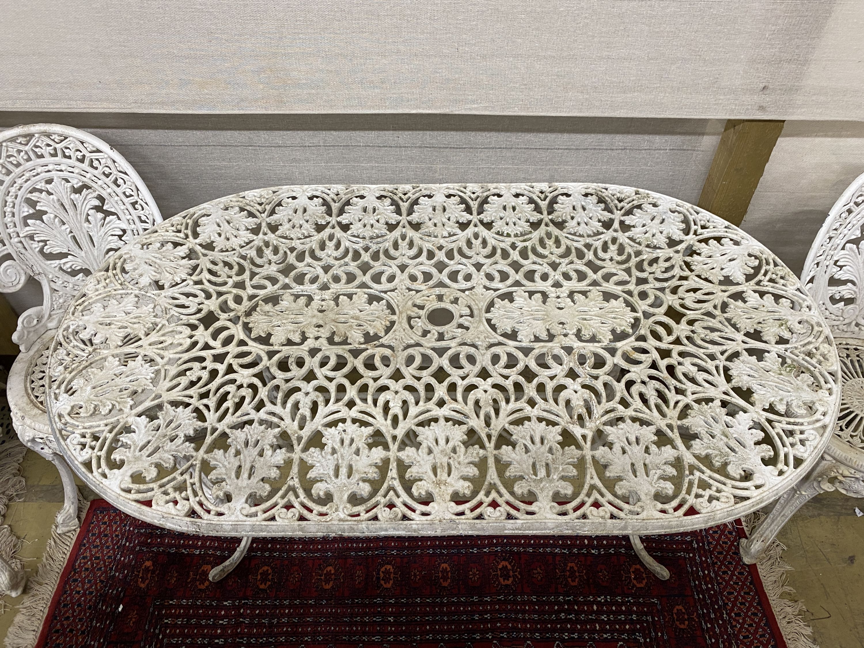 A five piece white painted metal alloy garden suite comprising two benches, length 137cm, pair of - Image 4 of 5