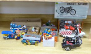 A collection of tinplate motorcycles etc