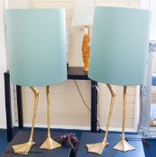 A pair of gilt composition 'goose leg' table lamps, duck egg shades, total height 93 cm